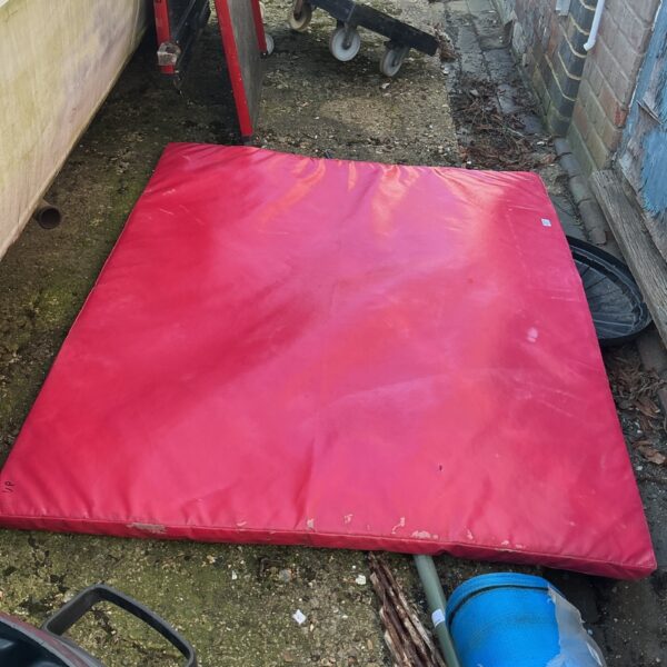 Large crash mat for gymnastics and landing practice.