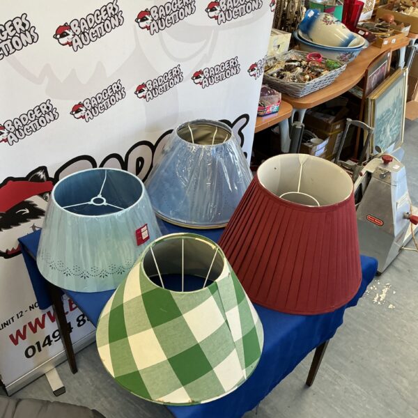 Quantity of large vintage lampshades for home lighting.