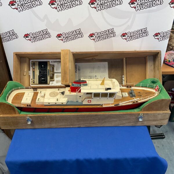 Large RC boat with Futaba controller in transit case.