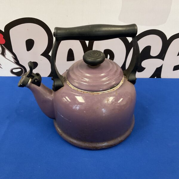 Vintage Le Creuset enamel kettle in a muted purple hue.