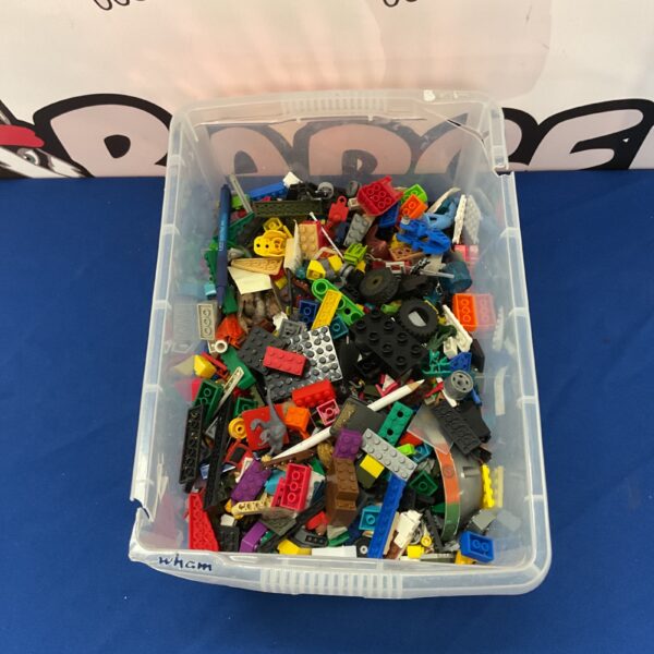 Assorted Lego bricks in a clear plastic container.