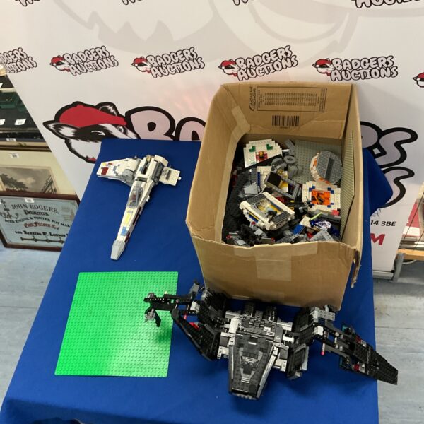 Incomplete Lego Star Wars sets with X-Wing model in a toy lot.
