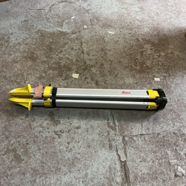Used Leica geodetic tripod for surveying equipment.