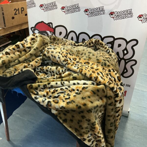 Soft leopard print throw blanket for home decor.