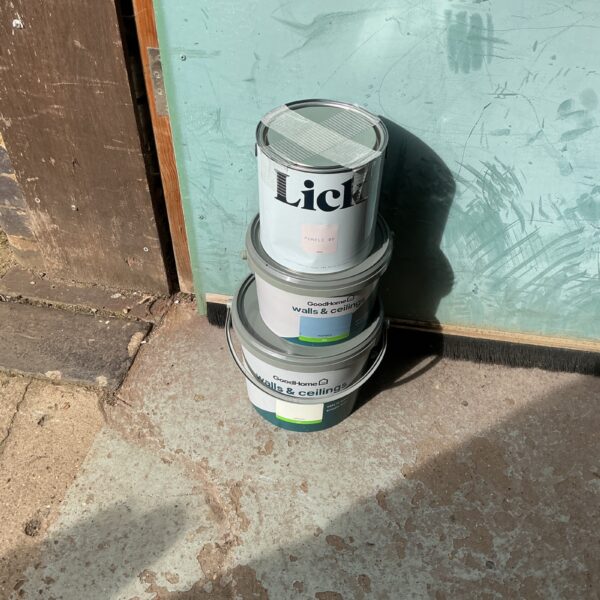 Collection of three Lick paint tins for home decorating.
