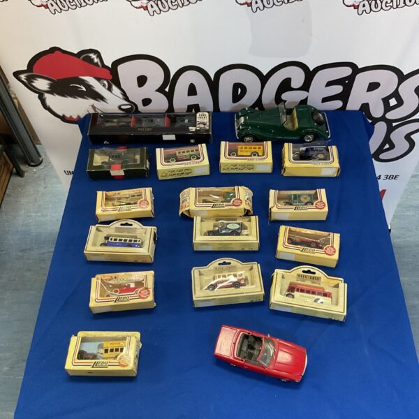 Lledo Days Gone diecast car lot with vintage vehicles.