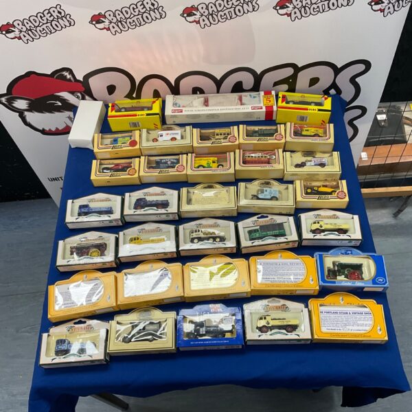 Large lot of Lledo diecast cars and collectible models.