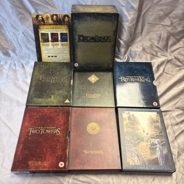 Lord of the Rings DVD trilogy extended edition set on a patterned surface.
