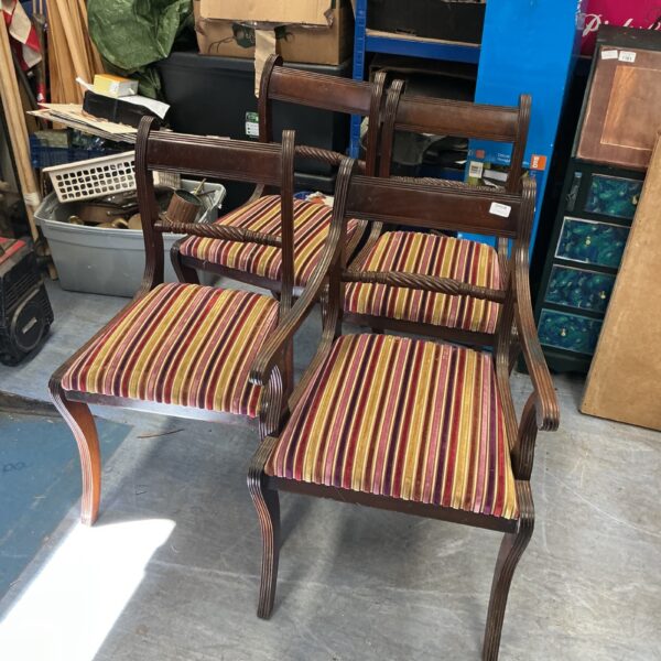 Lot of four vintage mahogany dining chairs with upholstered seats.
