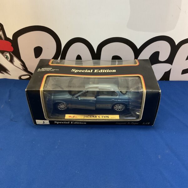 Blue Maisto Jaguar S-Type diecast model car on display.