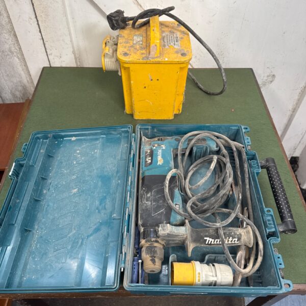 Vintage Makita 110v drill with transformer block in a case.