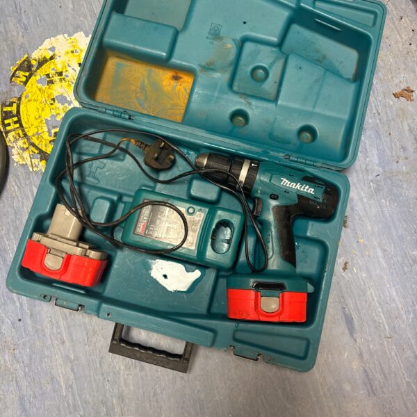 Vintage Makita cordless drill set in open carrying case.