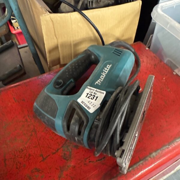 Vintage Makita jigsaw power tool for woodworking and DIY projects.