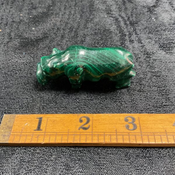Vibrant green malachite hippo figurine, detailed stone carving.