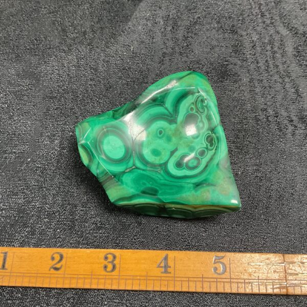 Vibrant green malachite pin dish with swirling patterns.