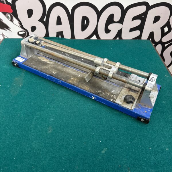 Vintage manual tile cutting machine for ceramic flooring.