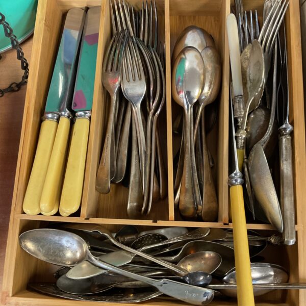 Overview of a Mappin and Webb cutlery tray with mixed silver plated pieces.