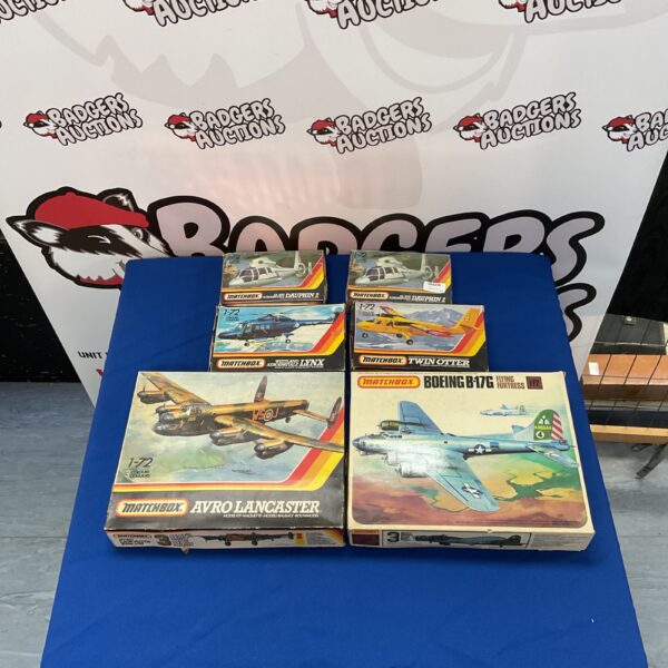 Vintage Matchbox model kits lot, including planes and helicopters.