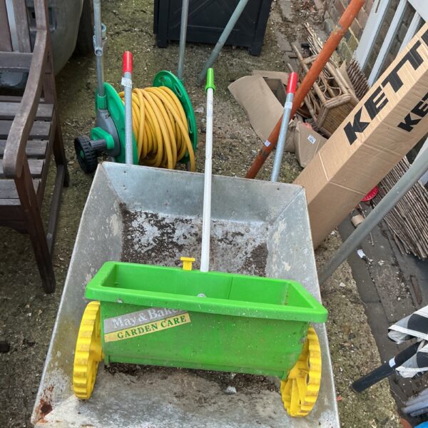 Vintage May and Baker garden seeder for precise seed distribution.
