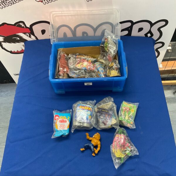 Large lot of vintage McDonalds Happy Meal toys in a container.