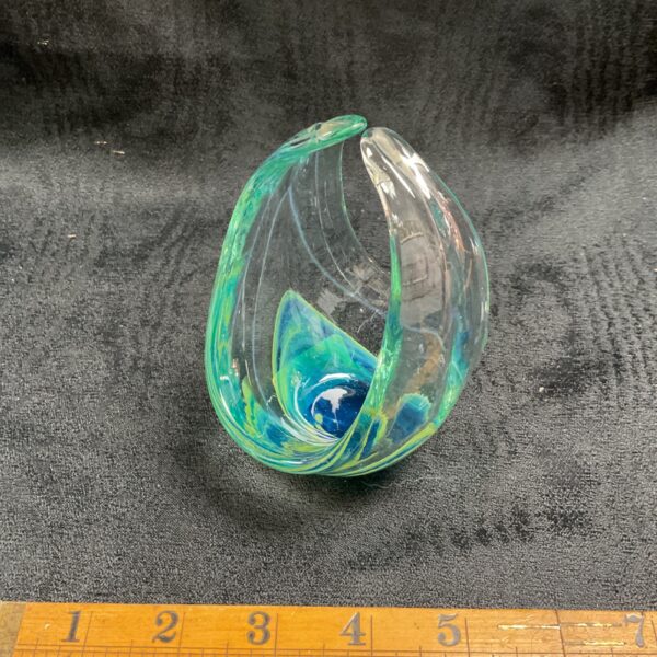 Vintage Mdina glass basket with blue, green, and yellow swirls.