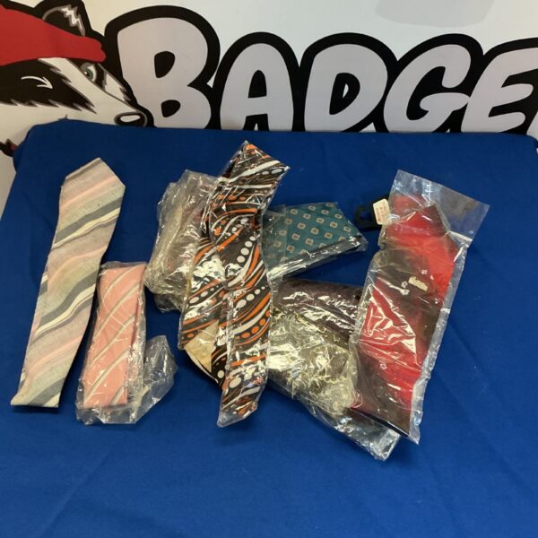 Lot of men's ties with varied patterns and colours.