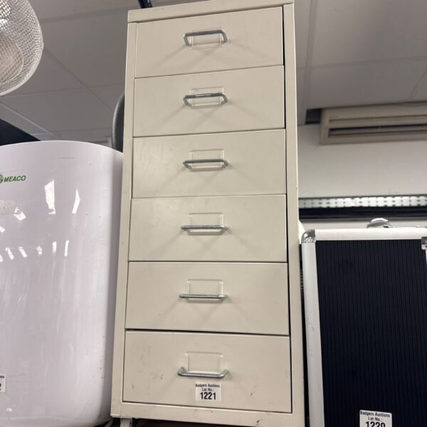 Silver metal filing cabinet with four drawers on wheels.