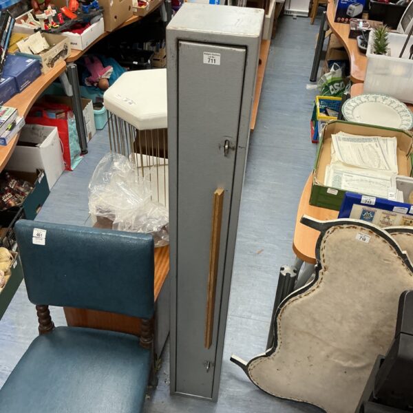Front view of a metal gun cabinet for secure storage.