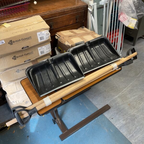 Lot of four metal snow shovels for winter use.