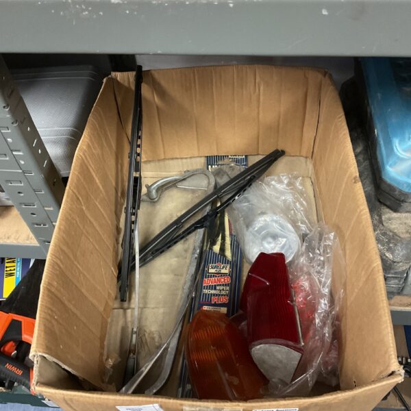 Assortment of vintage MG car parts for restoration.