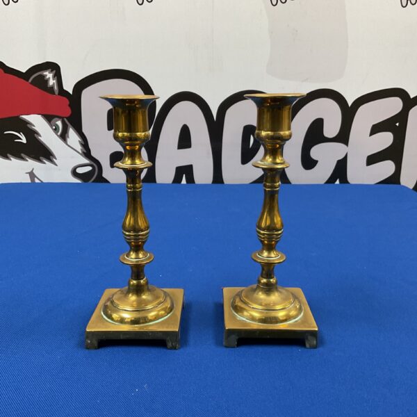 Vintage mid-century brass candlesticks for home decor.