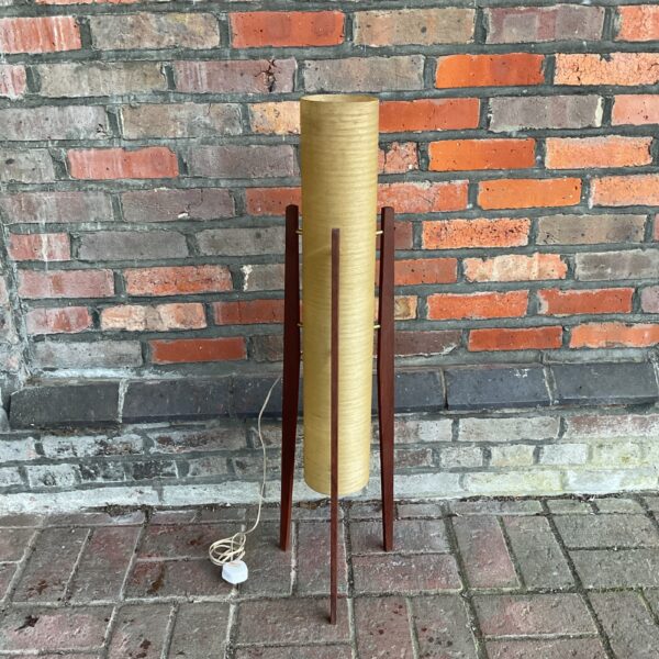 Vintage mid-century modern floor lamp with tapered legs.