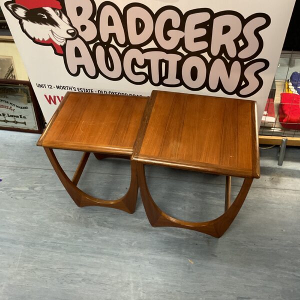 Vintage mid-century modern nest of tables in warm wood tone.