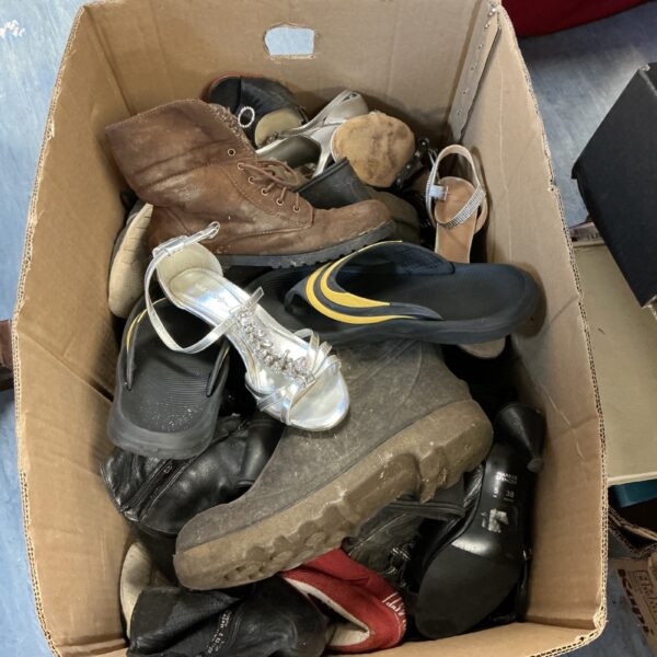 Mixed footwear lot including wellington boots and trainers.