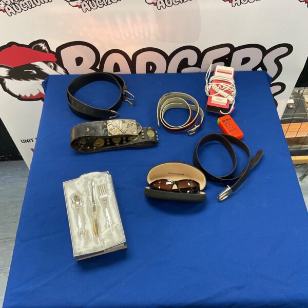 Mixed lot of belts, sunglasses, and accessories.
