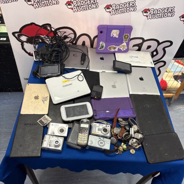 Mixed lot of used electronics including iPads and cameras.