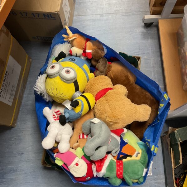 Mixed lot of colourful soft toys and plush animals.