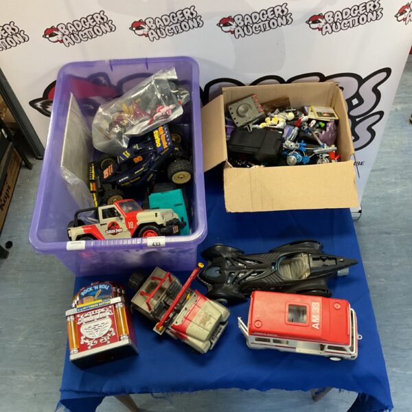 Mixed toy lot featuring Jurassic Park Jeep and Batmobile.