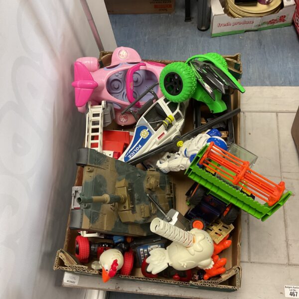 Mixed toy lot including RC tank, Fisher Price plane, and Playmobil firetruck.