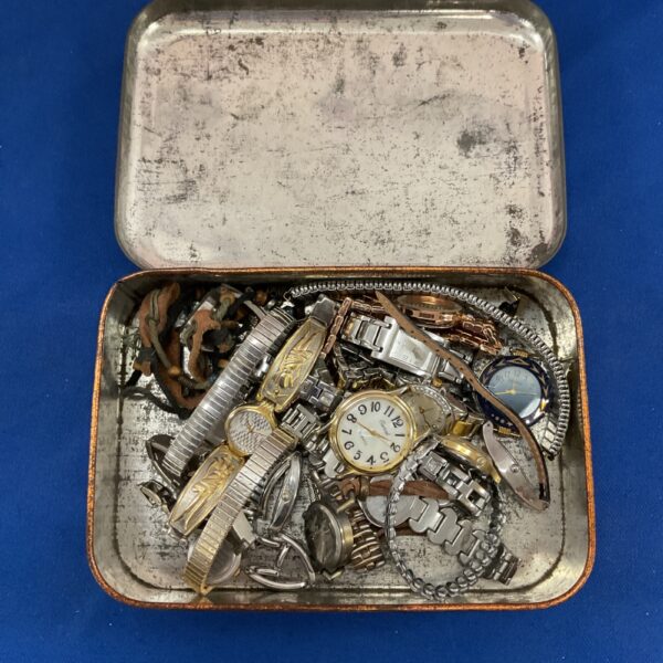 Tin of mixed vintage and non-working wristwatches for repair.
