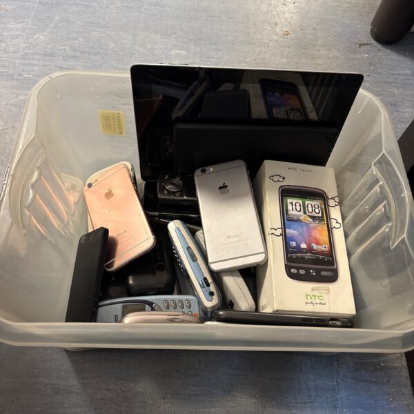 Mixed lot of vintage and modern mobile phones, including Apple and Nokia.