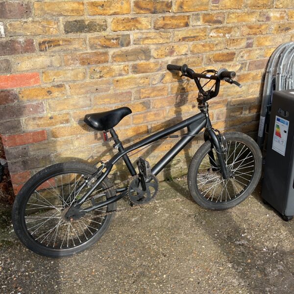 Side view of a vintage Mongoose BMX bike.