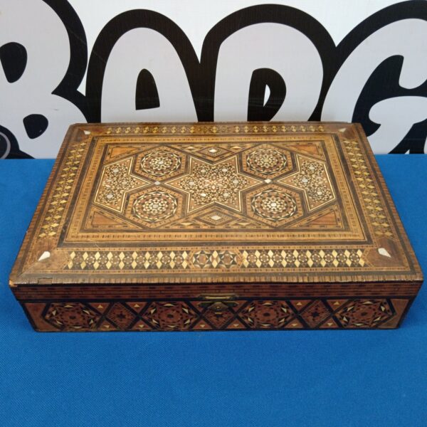 Intricate Moroccan marquetry box with mother of pearl inlay.