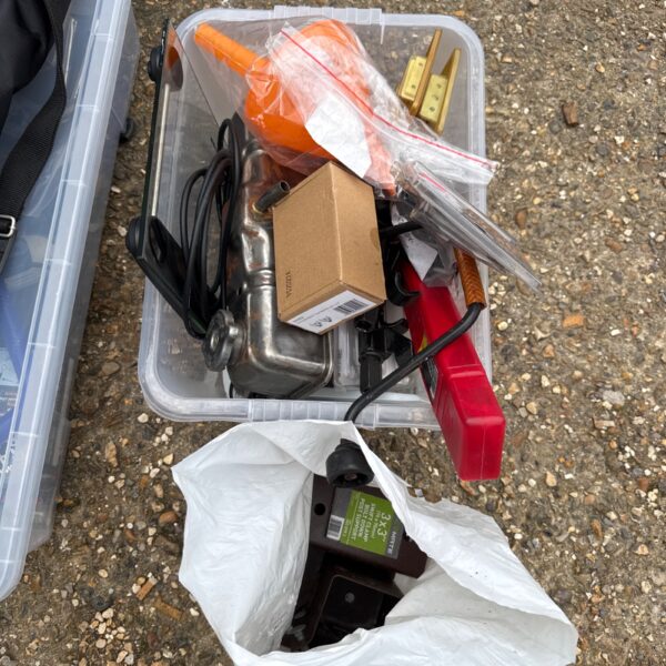 Mixed motoring lot in a plastic storage box.