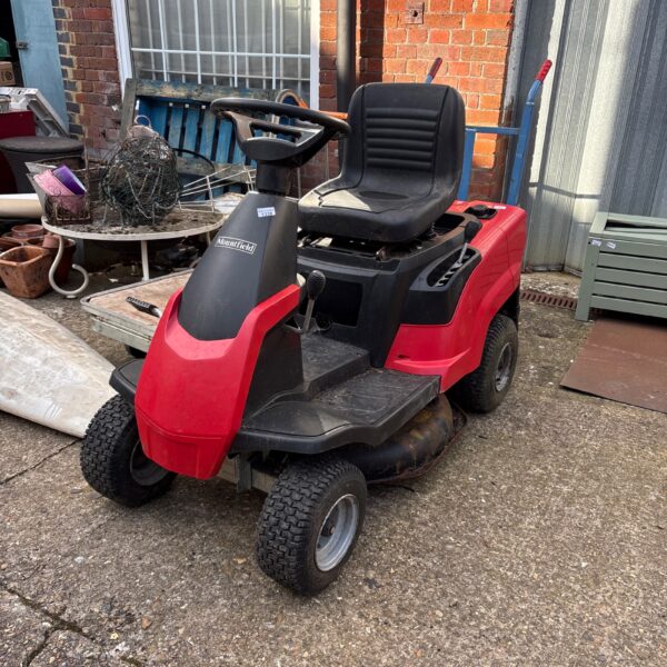 Red Mountfield 827 H ride on lawn mower in used condition.
