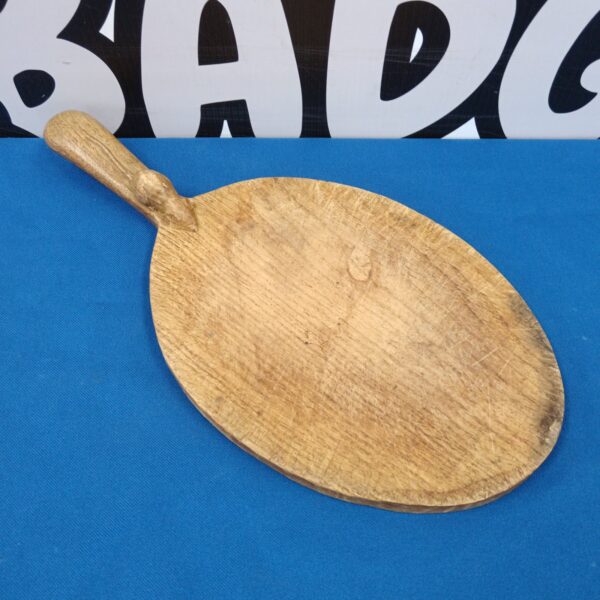 Vintage Mouseman chopping board with carved mouse detail.