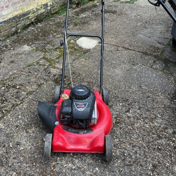 Vintage Murray Rough Cut petrol lawnmower for garden maintenance.