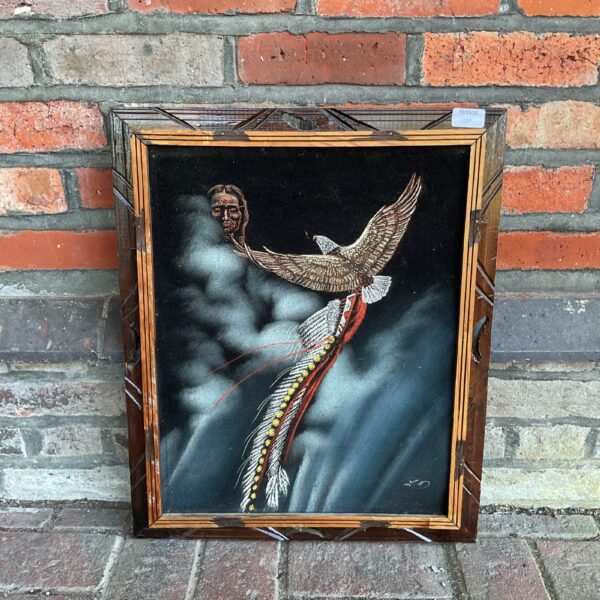 Vintage velvet painting of a Native American warrior and eagle.