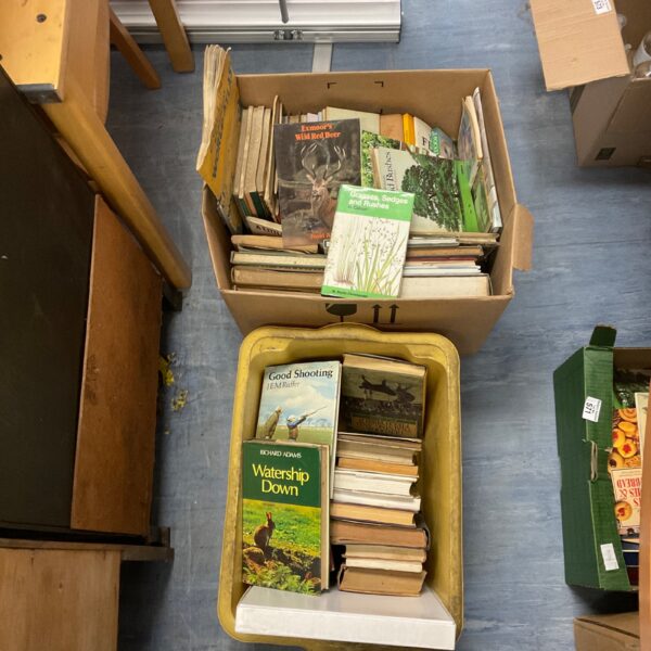 Two boxes filled with a vintage nature book collection.