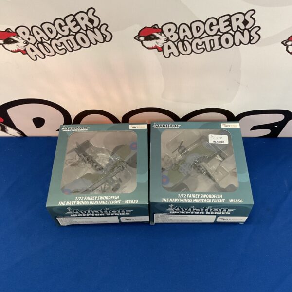 Two Navy Wings Fairey Swordfish W5856 diecast scale models for collectors.